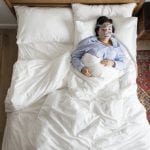 Overhead photo of a woman sleeping with an OSA mask.